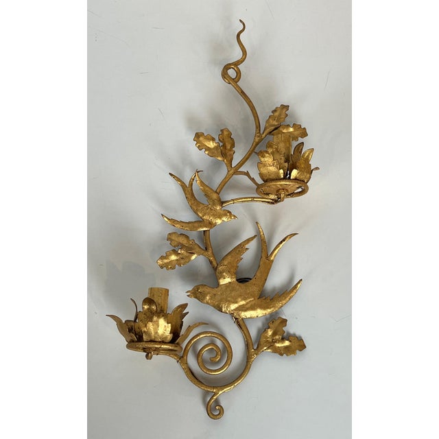 This pair of highly decorative wall sconces features gilded metal birds. It is a French work in the style of Maison...