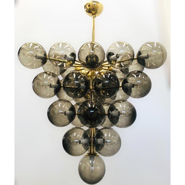 Italian chandelier with smoky Murano glass globes hand blown with bubbles inside the glass using Bollicine technique,...