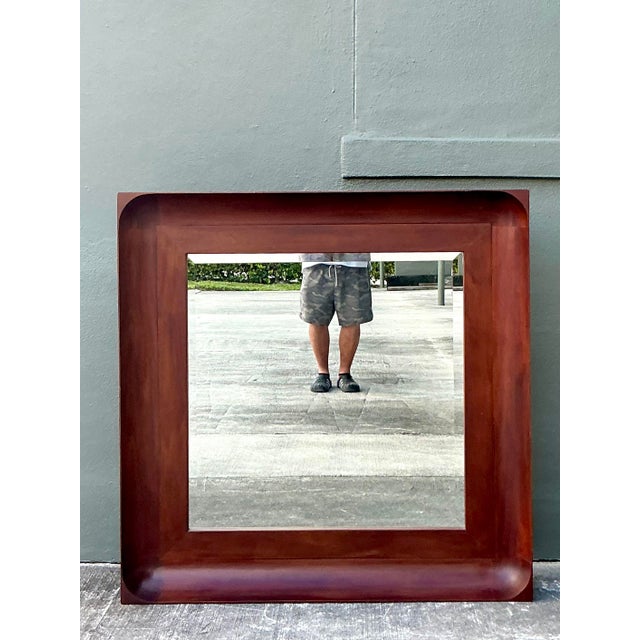 Anchor your space with the commanding presence and timeless American luxury of this monumental vintage mirror by Ralph...