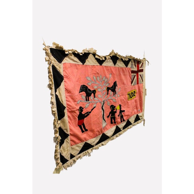 A standout original Asafo flag, hand-appliquéd by Fante makers on the coast of Ghana. The asafo warrior companies created...