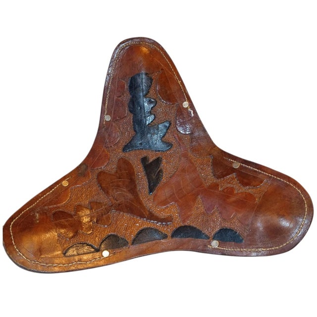 Bring home a 1970s character with this vintage leather tripod campaign stool. Featuring a beautifully aged, hand-tooled...