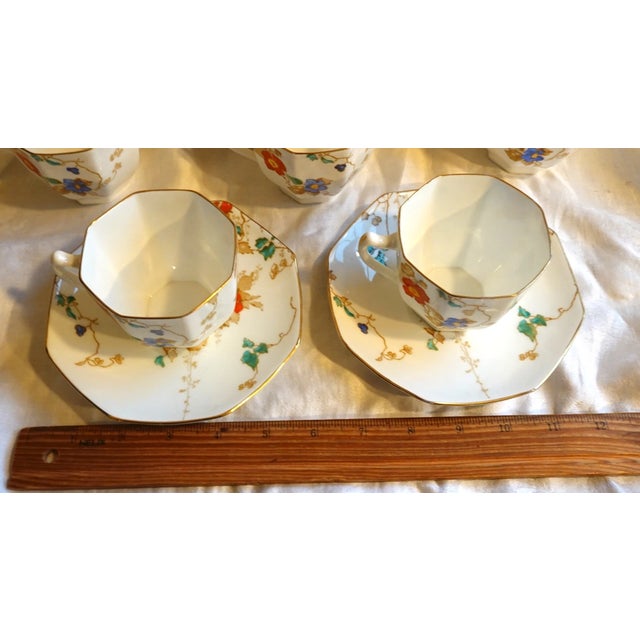 Striking and highly collectible, this vintage Art Deco Royal Doulton “Kew” cups and saucers set features the sought-after...