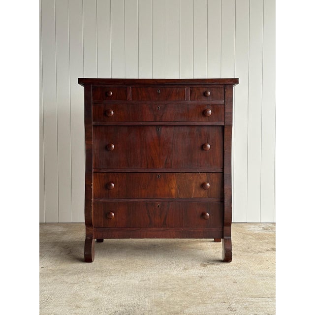 Antique chest with three small drawers over four full-width drawers. Original turned wood knobs and inset key escutcheons....