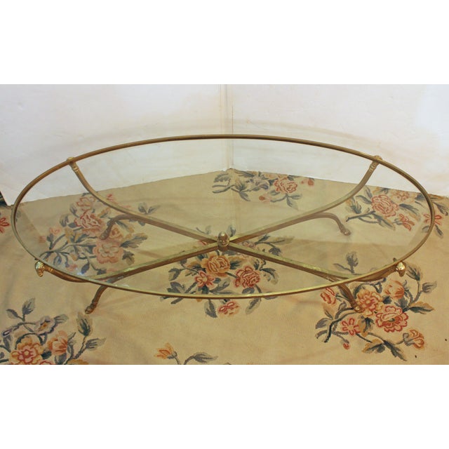 Circa 1980 Italian brass & glass oval coffee table. Acquired in 1980 from Lord & Taylor. Original surfaces. Small scratch...