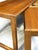 A practical and elegant set of nesting side tables in solid teak, dating from the early 1970s. The warm, close-grained...