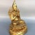 This finely crafted seated Tsongkhapa statue is cast from brass with a gilded finish, featuring intricate carving details...
