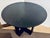Original retail $3490, stylish Currey & Company Modern Black Cerused Oak Finished Blake Dining Table, brass capped base,...