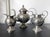A three-piece set of Chinese export sterling silver tea or coffee service circa early 20th century. The service consists...
