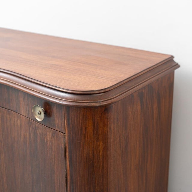 Brown wooden sideboard. 4 drawers. 4 doors with locks. Metal knobs. Excellent condition, as shown in photos. May have...