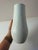 Artistic Relief Object: This tall, white porcelain vase by Hans Achtziger for Hutschenreuther perfectly embodies the...
