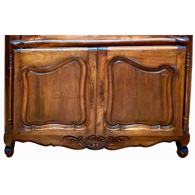 Offered here is an antique Louis XV-style carved walnut sideboard. The warm, rich patina and the period hinge hardware...