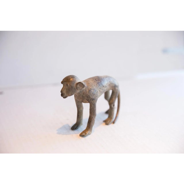 :: Vintage handmade African monkey sculpture. Circa late mid 20th century, though possibly older, this piece has such...