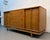 This quintessential mid-century modern triple dresser features a warm, rich walnut finish and a signature "floating"...