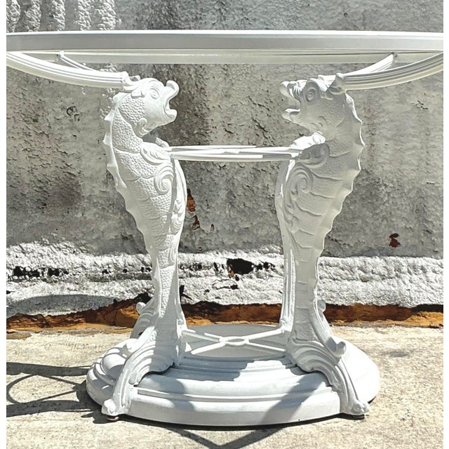 Infuse your dining space with coastal charm and artistic elegance with this exquisite vintage wrought iron koi dining...