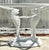 Infuse your dining space with coastal charm and artistic elegance with this exquisite vintage wrought iron koi dining...