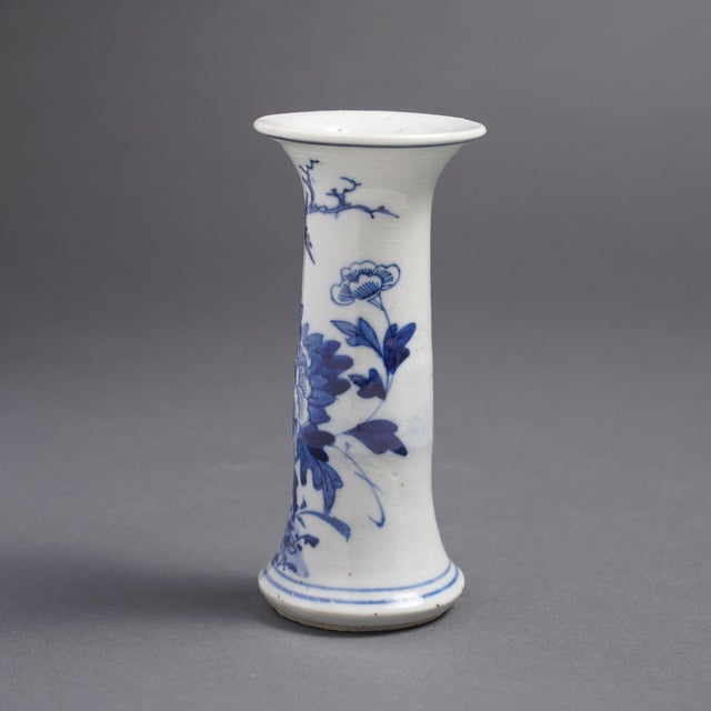 Chinese provincial porcelain trumpet form vase on a flaring foot. This diminutively scaled vase is decorated fully in the...