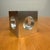 A captivating fusion of industrial technique and sculptural minimalism, this 3-inch solid aluminum cube (signed and...