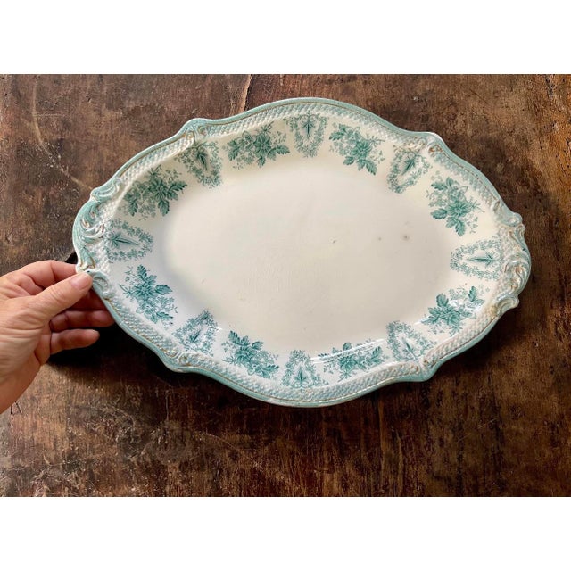 Stunning antique English platter, by WH Gendley. Presented in the Brussels pattern, it is a crisp white with a teal green...