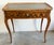 French Louis XV writing desk with a embossed leather top surrounded by pierced gallery trim along with cabriole legs...