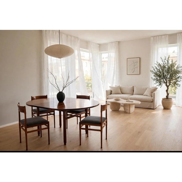 Elegant vintage Scandinavian dining set from the mid-century era, dating back to the 1950s and 1960s. The round/oval...