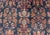 Textile Early 20th Century Antique Mahal Rug With Dark Blue Field and Red Border Filled With Floral Motifs For Sale - Image 7 of 9