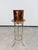 A rare and highly sophisticated antique Art Nouveau plant stand (pedestal), masterfully crafted from solid brass in the...