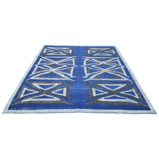 Moroccan Azilal hand knotted wool rug with geometric design.