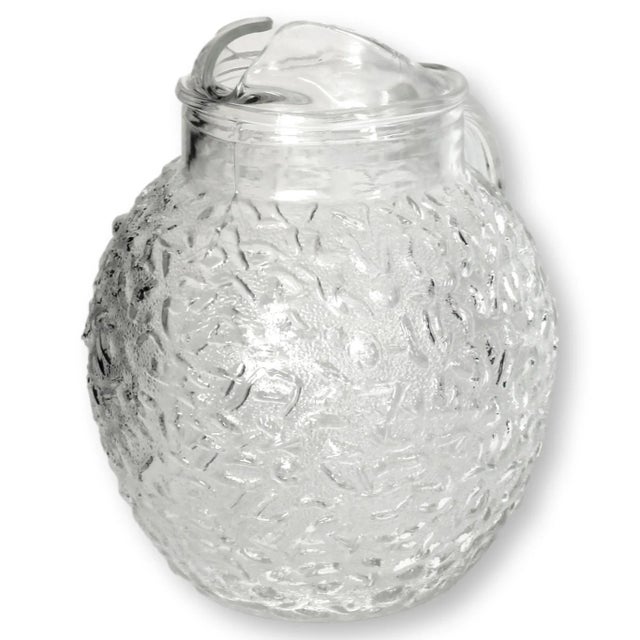 Iconic glass lemonade / iced tea pitcher from the 1970s. Most homes had one of these in varying colors.