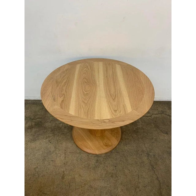 W41.75 D41.75 H30.75 KC29.75 Forma dining table custom made here in Los Angeles. This table includes a clear natural...