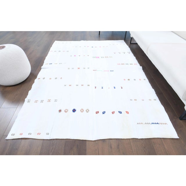 Vintage Turkish Hand-Knotted vintage rug is a semi-Vintage kilim area rug.'70s Eastern region of Turkey's unique rug is...