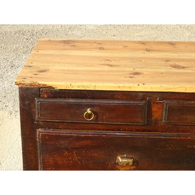 19th-century counter unit with a 2.7 cm thick pine top. It features three small drawers and three very large drawers, all...