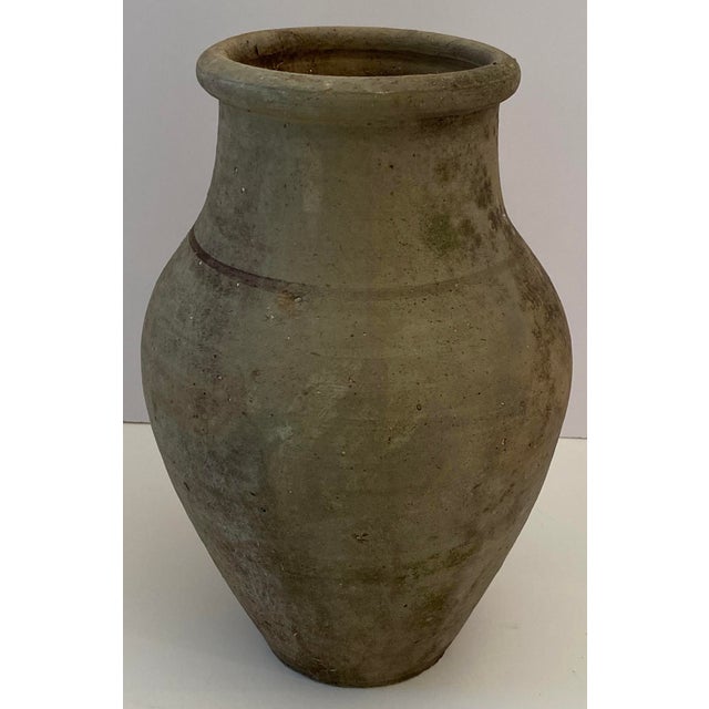 This charming clay pot is an excellent representation of Roman pottery, echoing the craftsmanship and aesthetic of ancient...