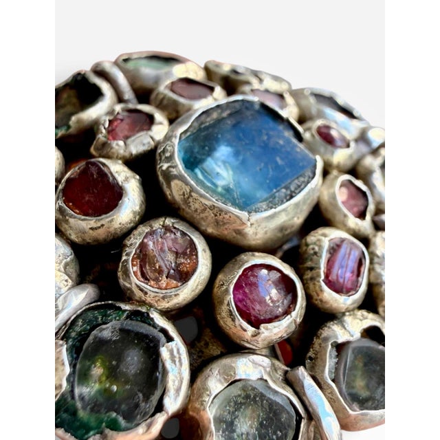 Acquired at auction in Paris, this dramatic antique silver ring features a broad, rosette-shaped cluster of individually...