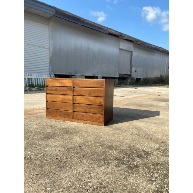 This babe photographs well! No doubt about that. Arne Wahl Iversen style lowboy dresser. Ten sleek drawers with carved...