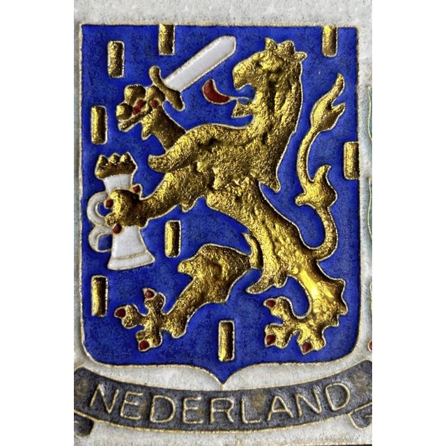 A mid-20th-century Royal Delft / De Porceleyne Fles cloisonné tile featuring the Dutch coat of arms with the crowned...