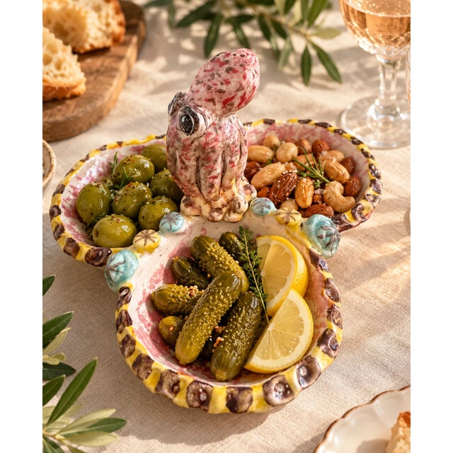 An octopus on the table is already a conversation starter. This Italian majolica dish features a sculptural octopus motif...