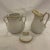 Perfect addition for your tea or coffee set. A fines Limoges old Paris porcelain white bodied sucrier with lid and ewer...