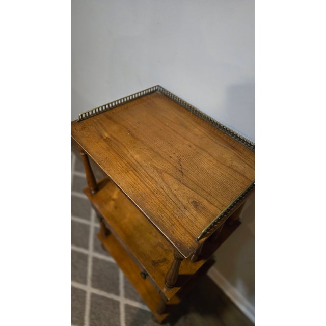 A charming three-tier wood whatnot / étagère believed to date to the late 19th century. The piece features a pierced...