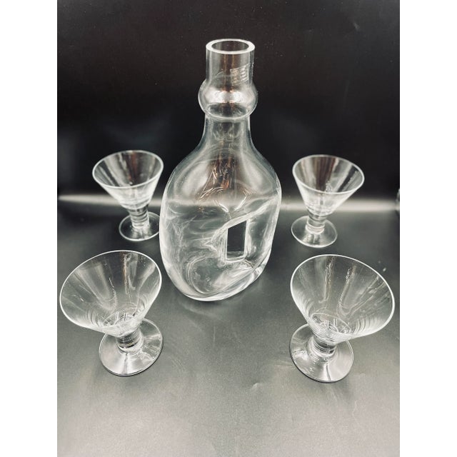 This stunning crystal cocktails set features a modernist/abstract style. The start and sleek design of the pieces make the...