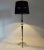 Stunning vintage floor lamp made of ebonized wood, onyx and brass with black fabric lamp shade. Produced in Italy in the...