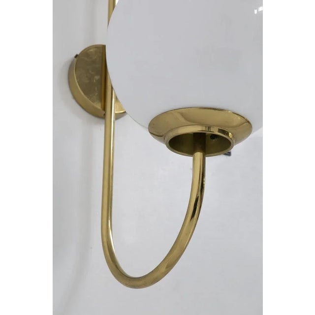 Splendid wall lamp designed by Luigi Caccia Dominioni in the 1950s for the Italian manufacturer Azucena. The wall sconce...