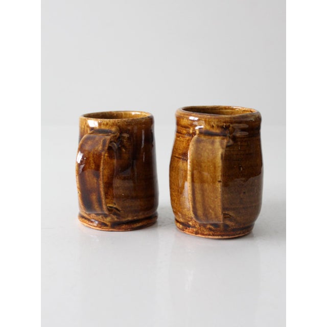 These charming, vintage pottery mugs are a perfect pair for a cozy morning or evening. Handcrafted with a rustic touch,...