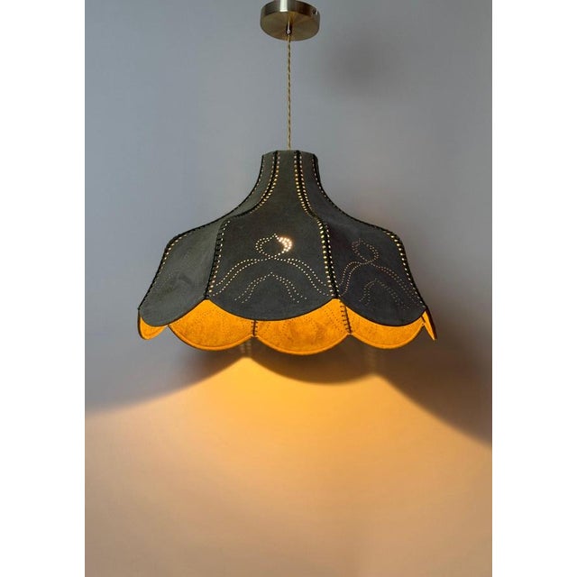 This exceptional pendant lamp, crafted in Italy in the 1970s, embodies masterful craftsmanship and timeless elegance. The...