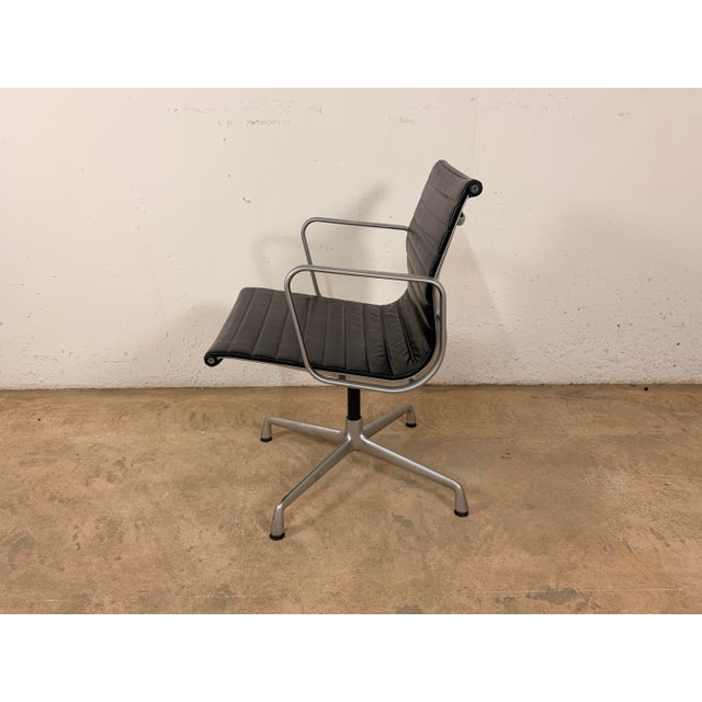 Mid-Century Modern EA 108 Office Chair in Black Leather with Polished Aluminum Frame by Charles and Ray Eames for Vitra For Sale - Image 3 of 13
