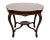 This antique English Rosewood center table features a string inlay with flowers, adding a touch of elegance to any room....