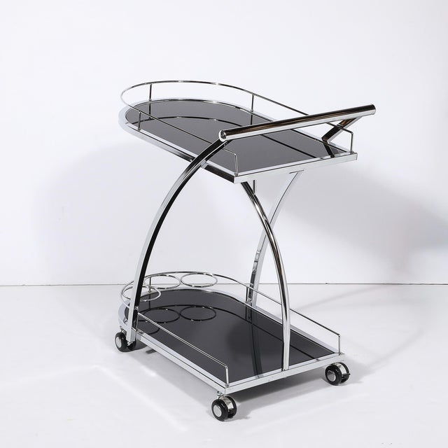 An exceptional Art Deco two-tier rolling bar/serving cart, featuring a sleek and distinctive bullet form design,...
