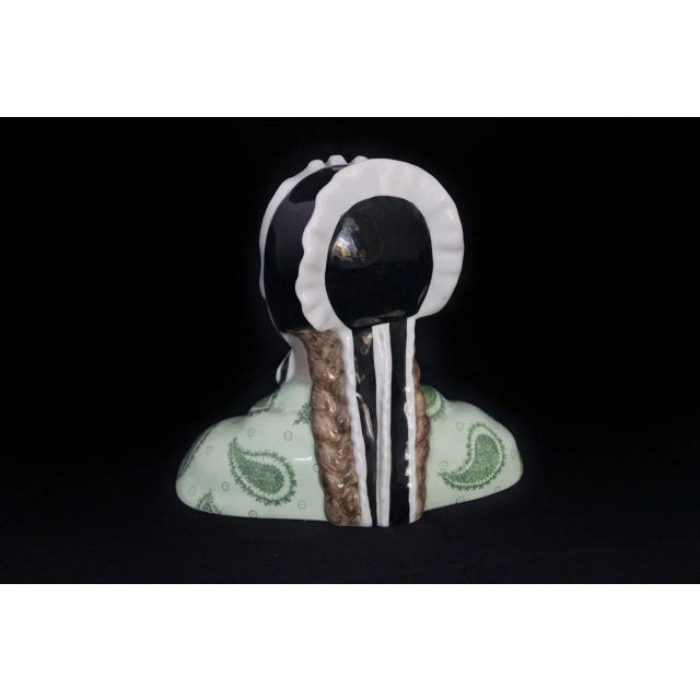 Bust of ceramic girl, dress and headdress, sweet face and well done expresses gentleness and serenity, dreamy eyes as if...