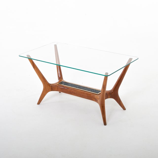 Italian modernist cocktail table attributed to Gio Ponti. Walnut, glass top, brass planter insert.