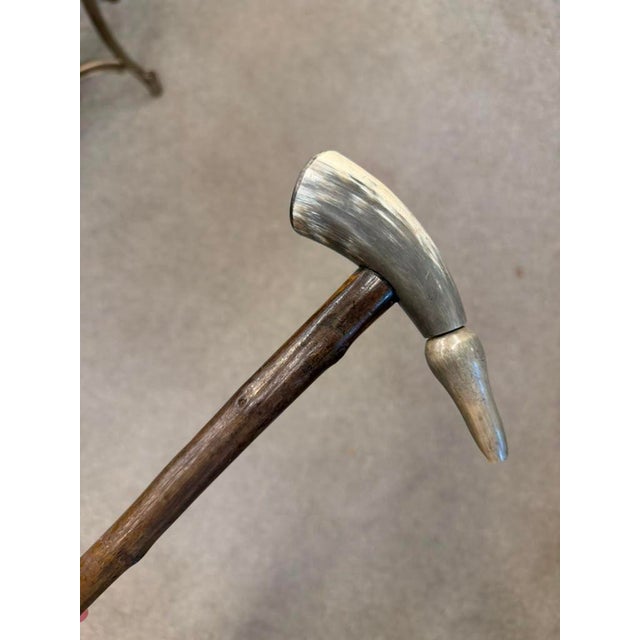 Distinctive late 19th-century Spanish cane dating to circa 1870, featuring a brierwood stem, carved horn handle, and brass...