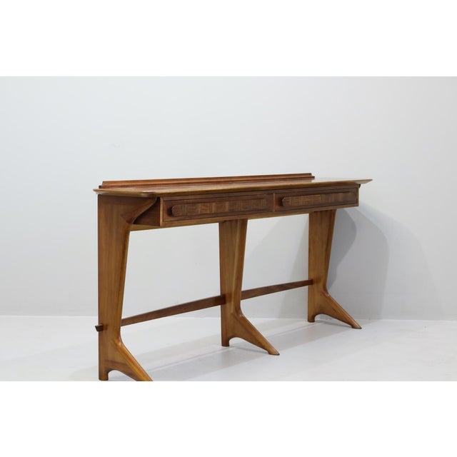 Rare and important mid-century Italian mahogany console table by Ico Parisi. Sculptural form with two drawers and...
